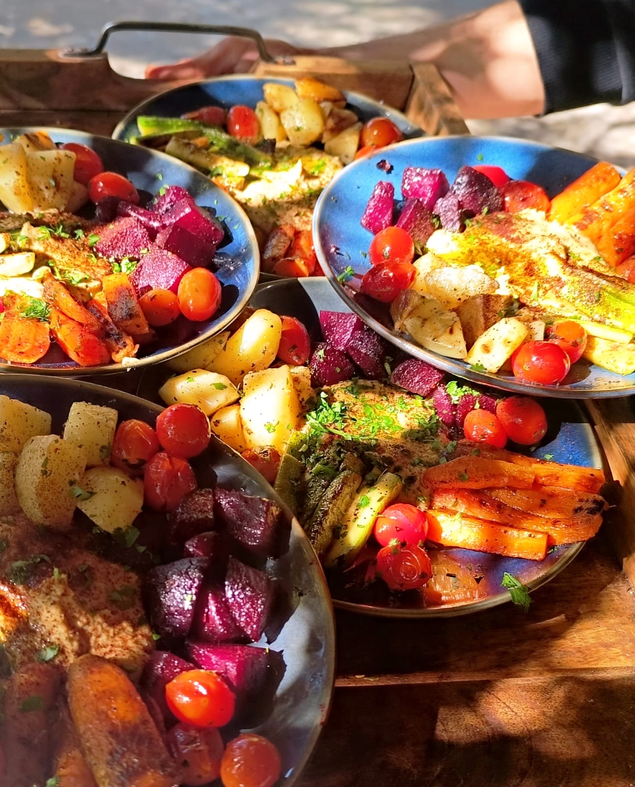 A generous spread of colourful farm dishes made with seasonal produce